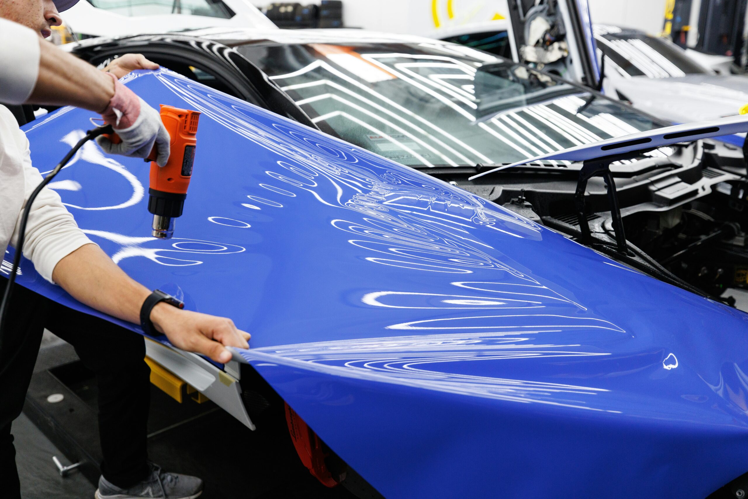 paint protection film vs car wrap, car wrapping vs PPF, PPF or wrap UK, PPF vs car wrapping UK, car protection film, vehicle wrapping services, PPF installers North London, car wrapping services north london, how much does PPF cost UK,car wrap vs paint